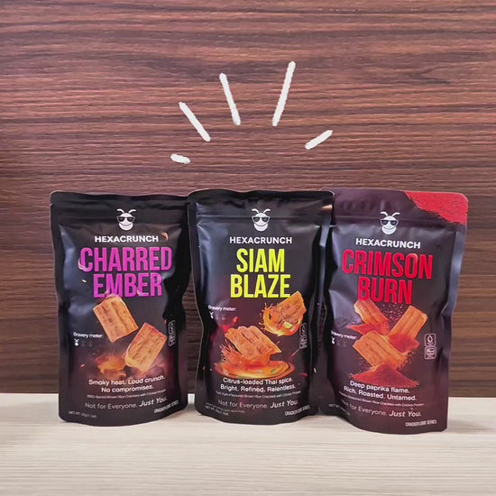HexaCrunch premium insect-protein crackers shown in a hero shot with three upright packs, followed by close-up pans of the packaging and protein details, ending with a product reveal of the baked crackers being poured into a bowl and shown in crisp, textured close-ups.