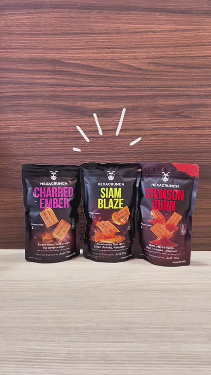 HexaCrunch premium insect-protein crackers shown in a hero shot with three upright packs, followed by close-up pans of the packaging and protein details, ending with a product reveal of the baked crackers being poured into a bowl and shown in crisp, textured close-ups.